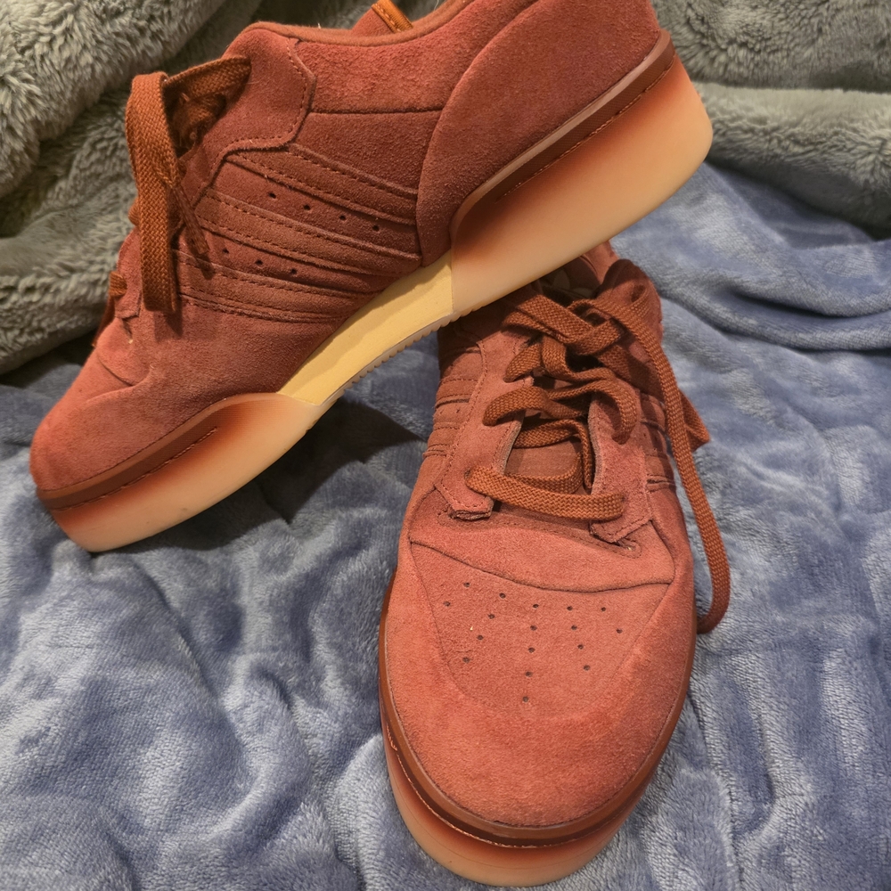  Adidas Rivalry Lux Low in the "Preloved Ruby / Powder Coral" colorway. 